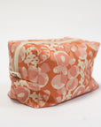 Floral-patterned pouch on a white background