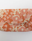 Floral patterned pouch on a white background