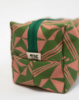 Fabric pouch with green and pink geometric pattern on a white background