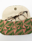 Fabric case with geometric pattern containing glasses on a white background