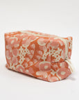 Floral-patterned makeup bag on a white background