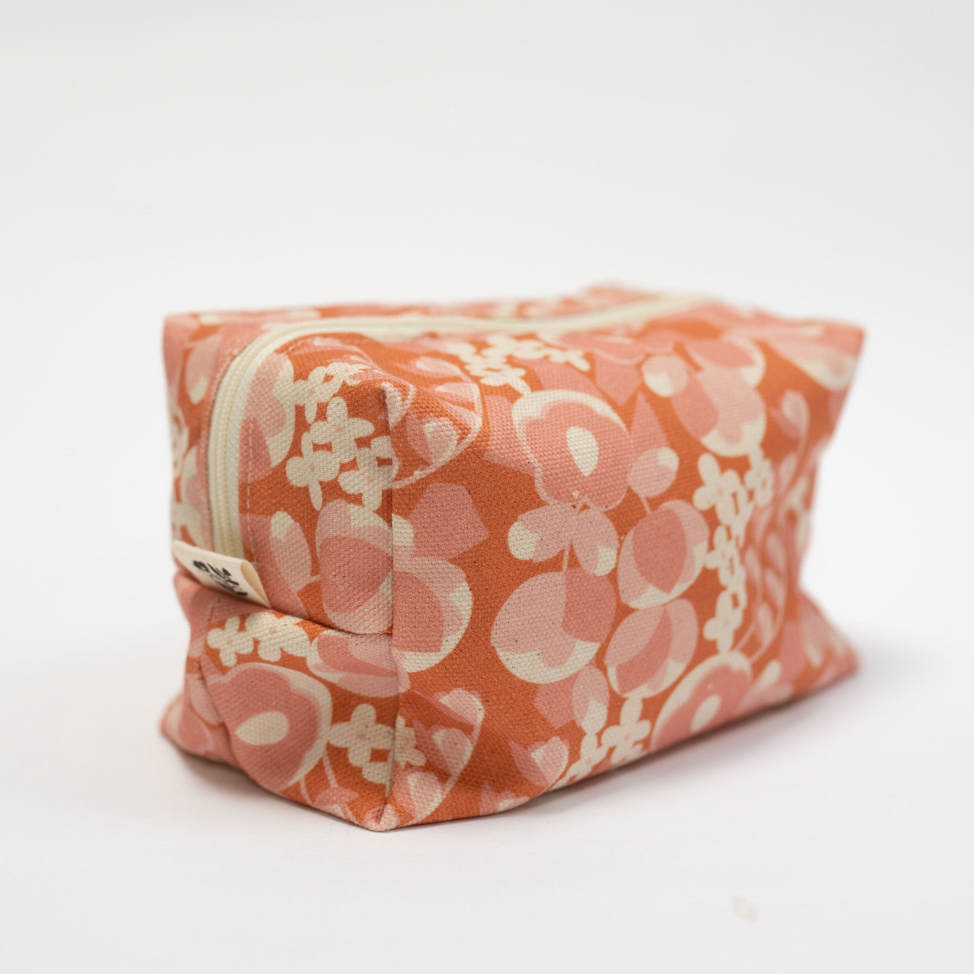Floral-patterned pouch on a white background