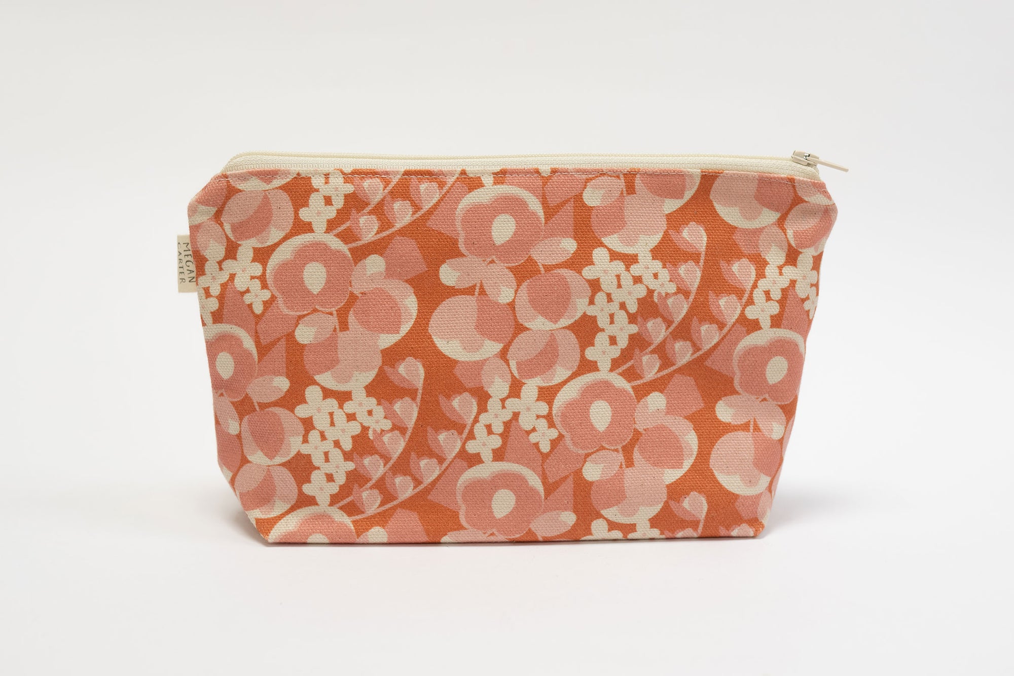 Floral patterned pouch on a white background
