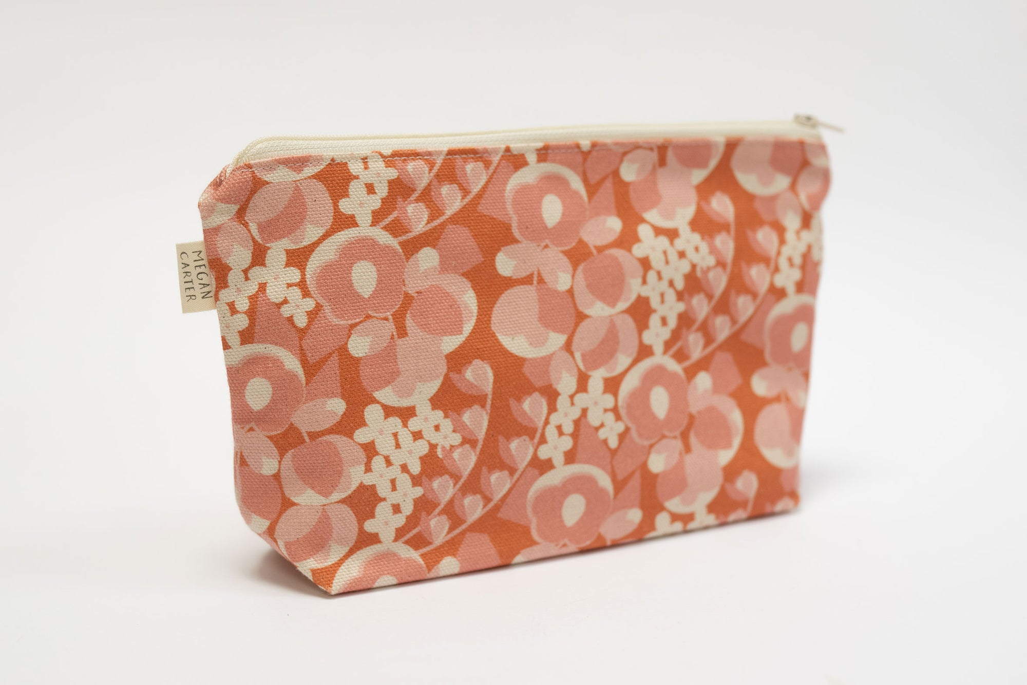 Floral patterned pouch on a white background