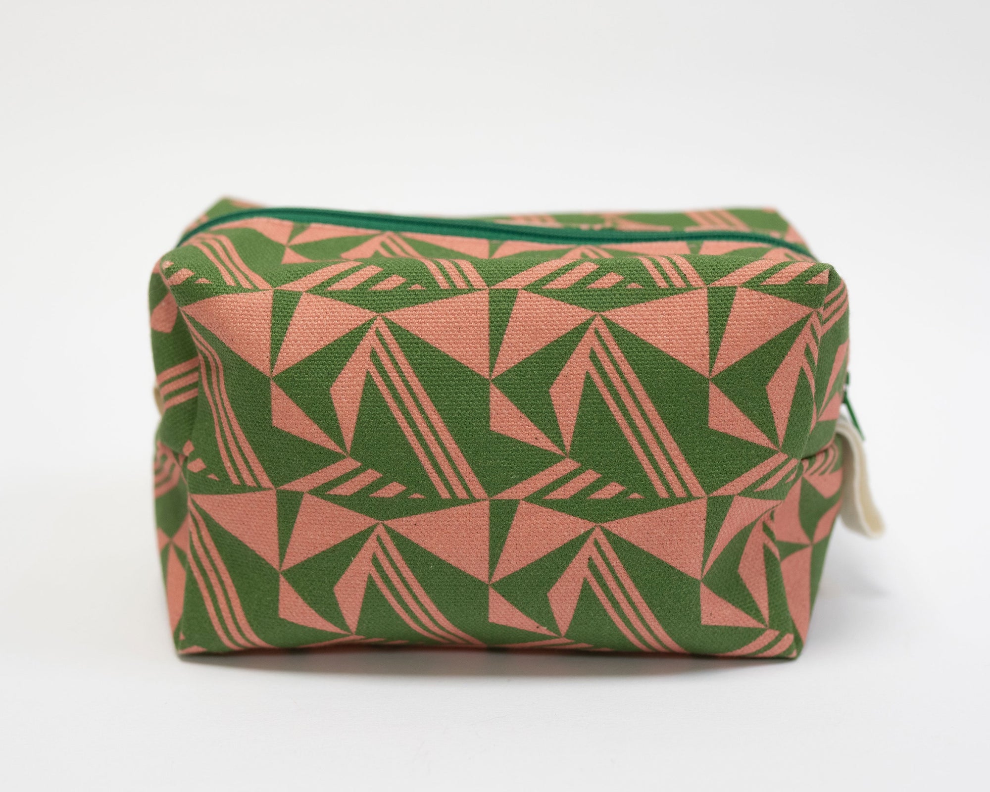 Rectangular pouch with green and pink geometric pattern on a white background