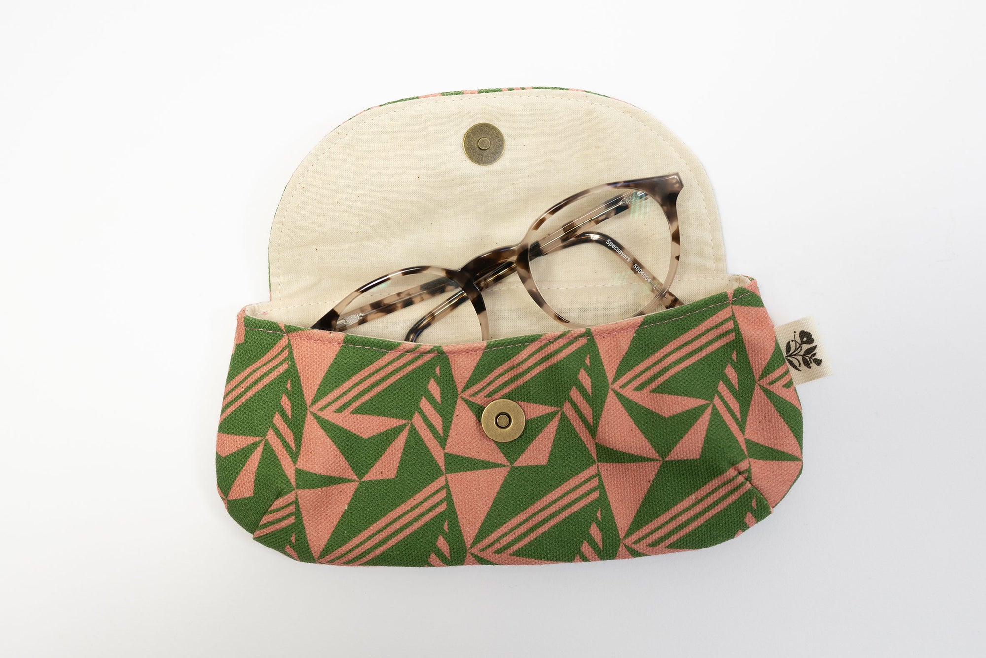 Fabric case with geometric pattern containing glasses on a white background