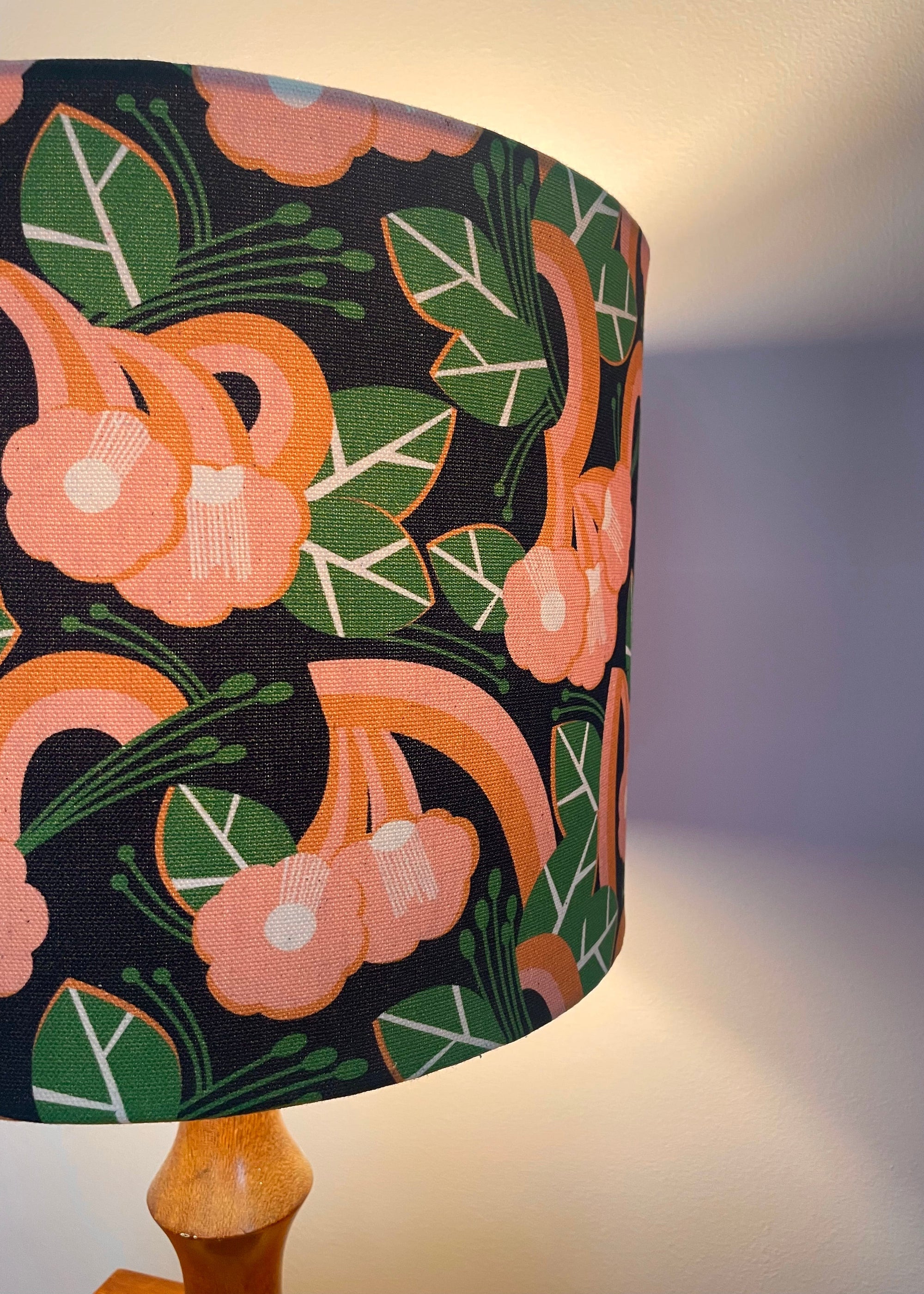 Lampshade with floral pattern on a plain background