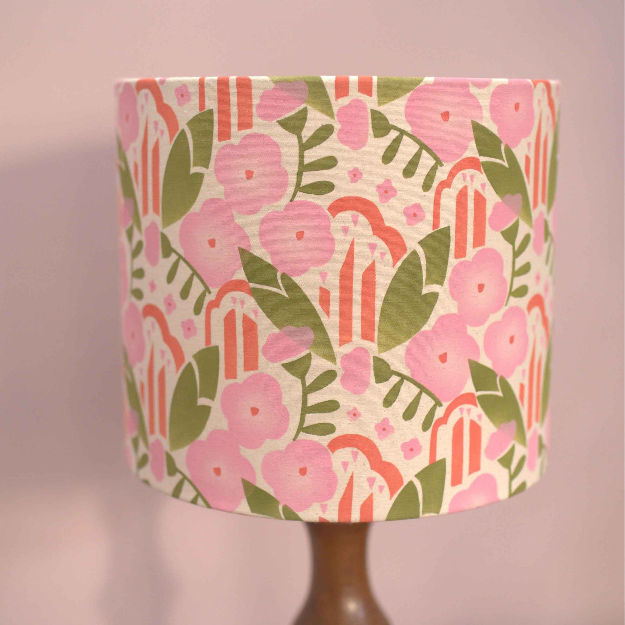 Floral patterned lampshade on a plain background