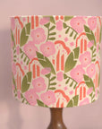 Floral patterned lampshade on a plain background