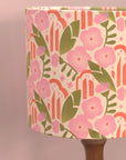 Floral patterned lampshade on a plain background